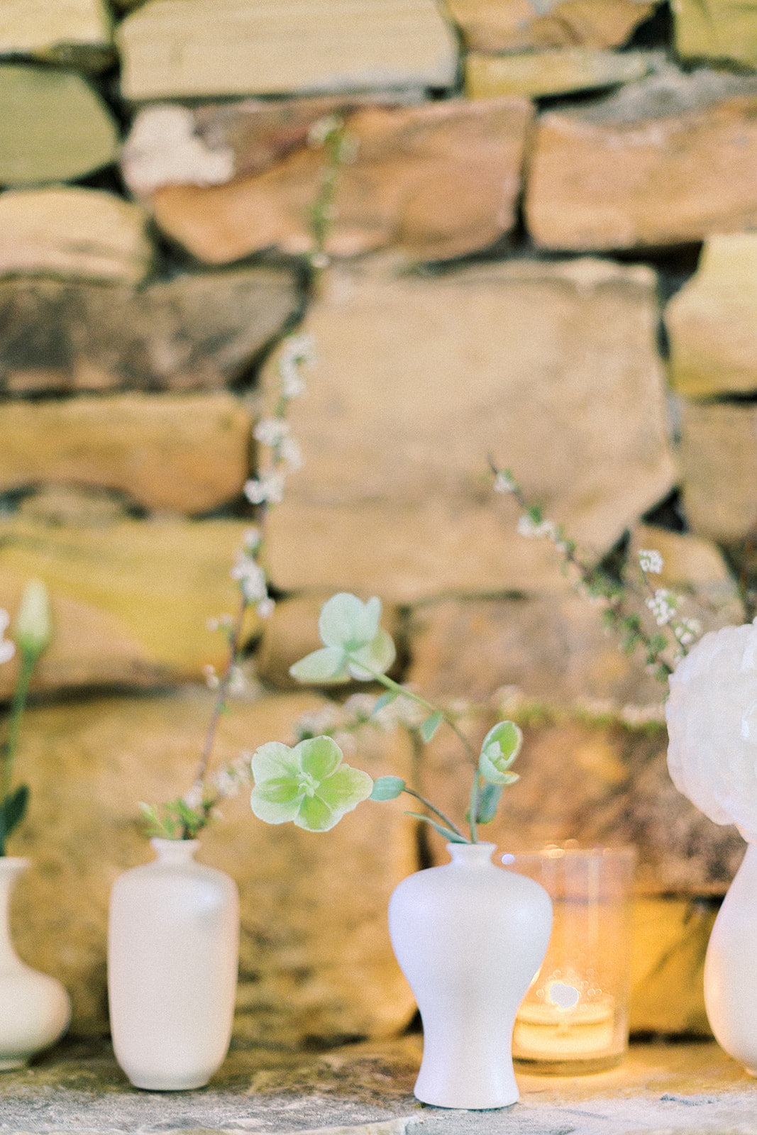 Organic florals in white bud vases