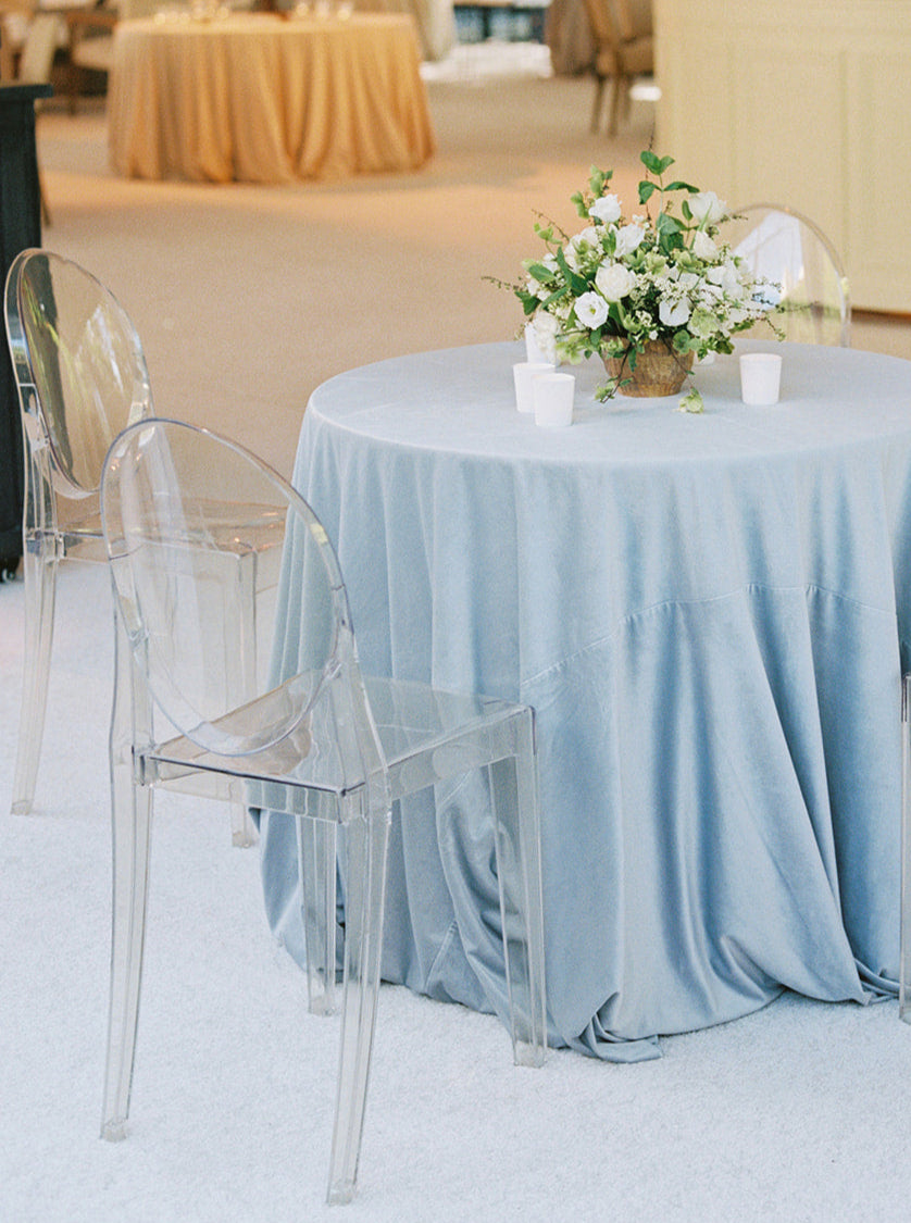 Golden hour dinner table with candles and soft-floral centerpieces.