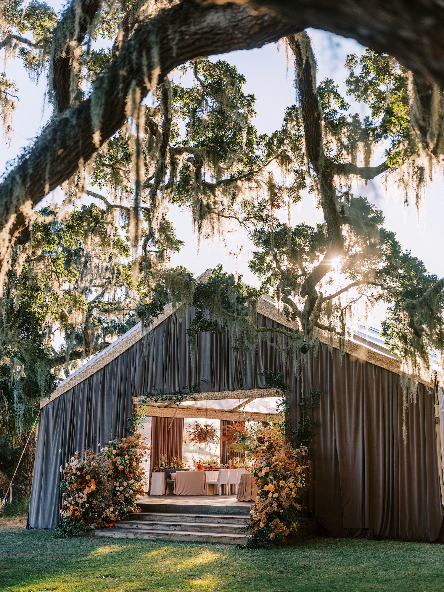 Fall wedding in South Carolina featuring a soft, romantic tented structure with layered textures and neutral tones