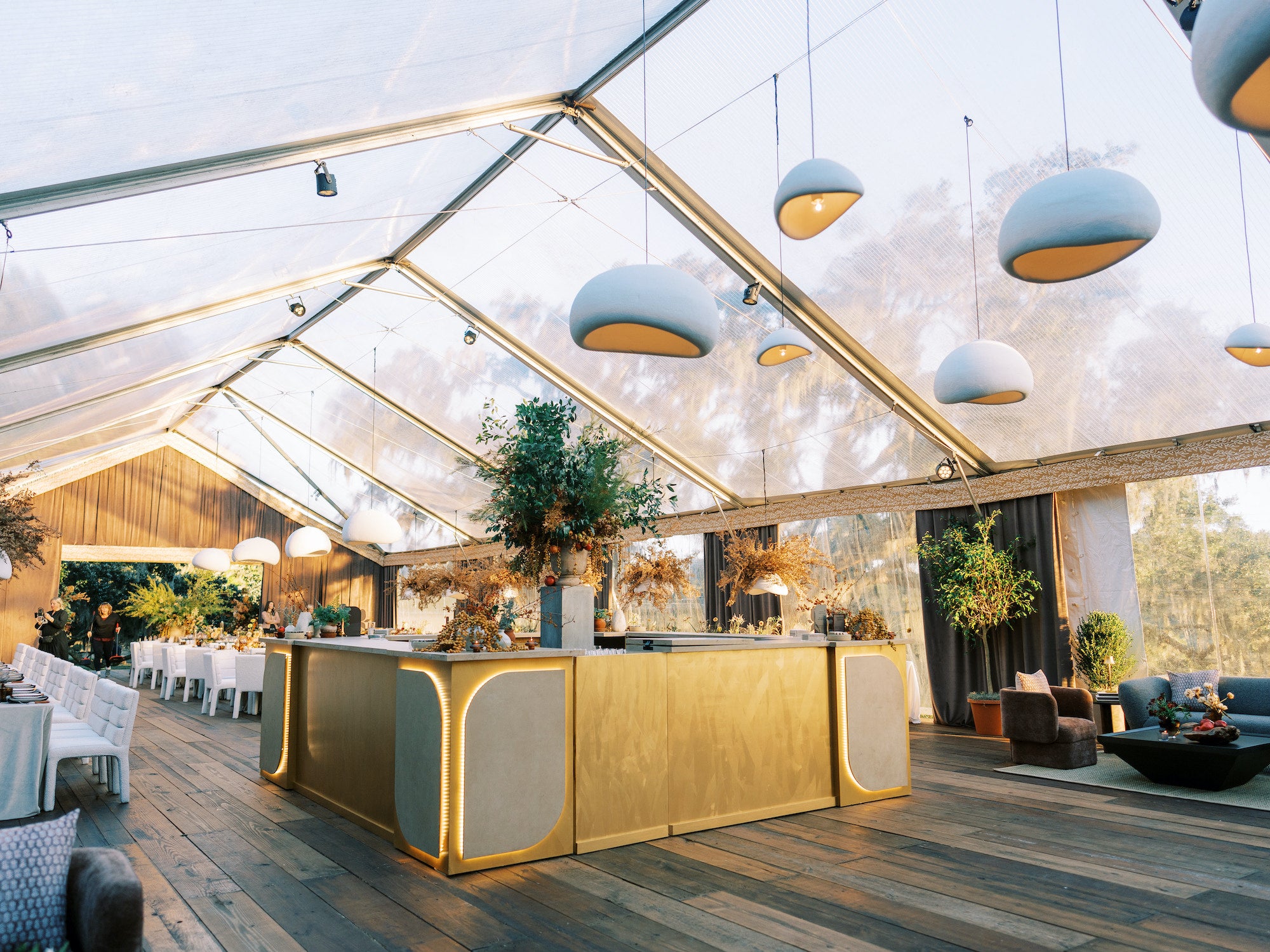 Gold-toned bar with clean lines and neutral styling by Mayker Events, designed as focal point of Kiawah River reception.