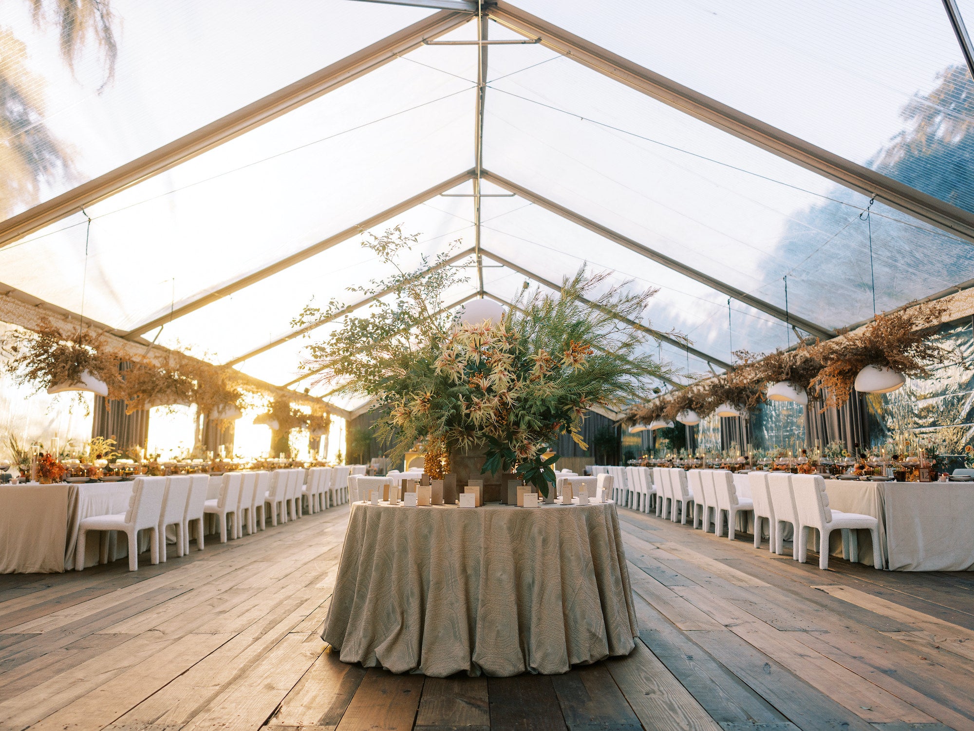 Tented reception at Kiawah River with velvet draping by The Social Spool, warm lighting, and curated rentals by Mayker Events.