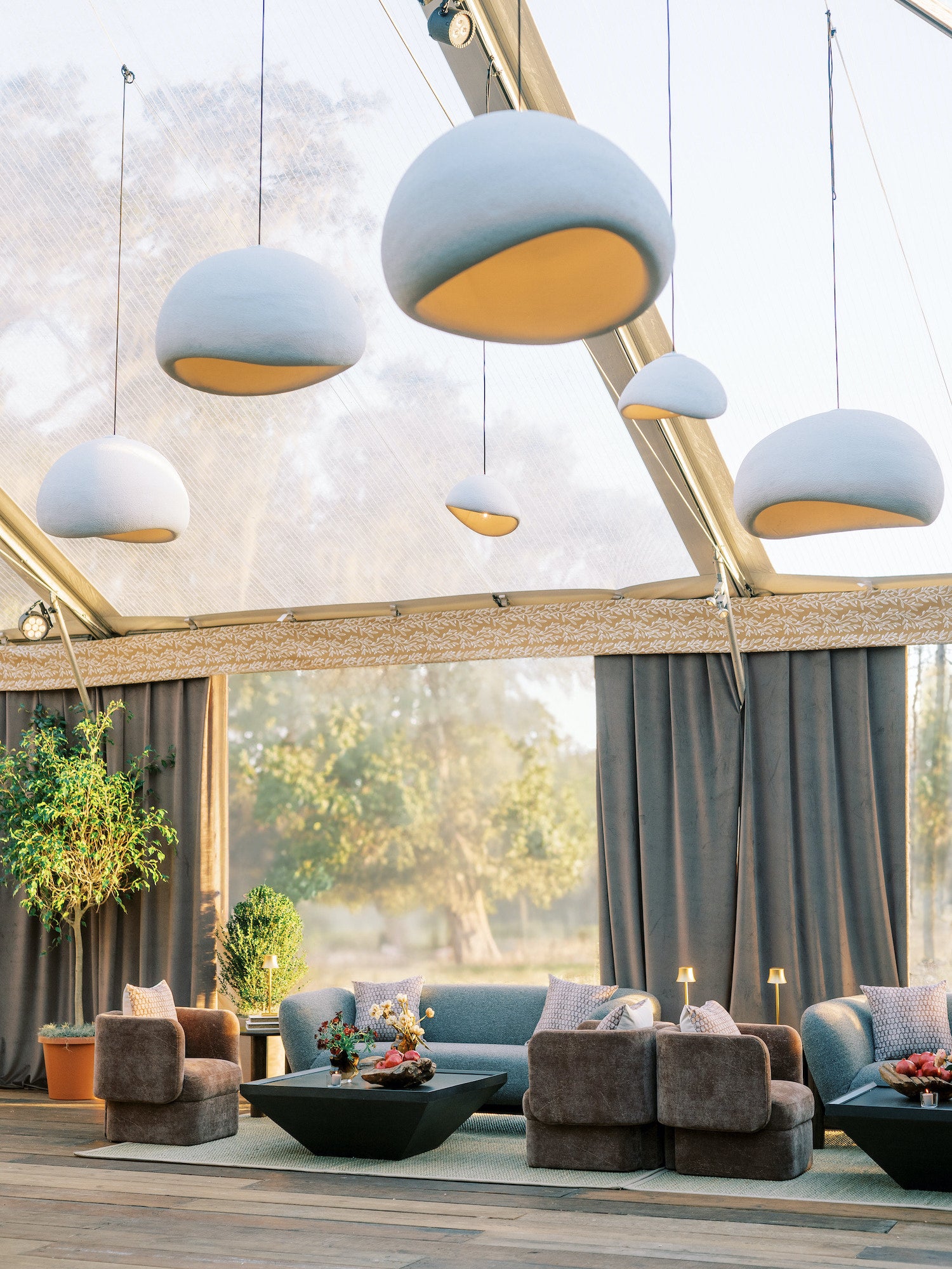 Relaxed wedding lounge setup in South Carolina with moody color palette and soft, tactile furnishings.