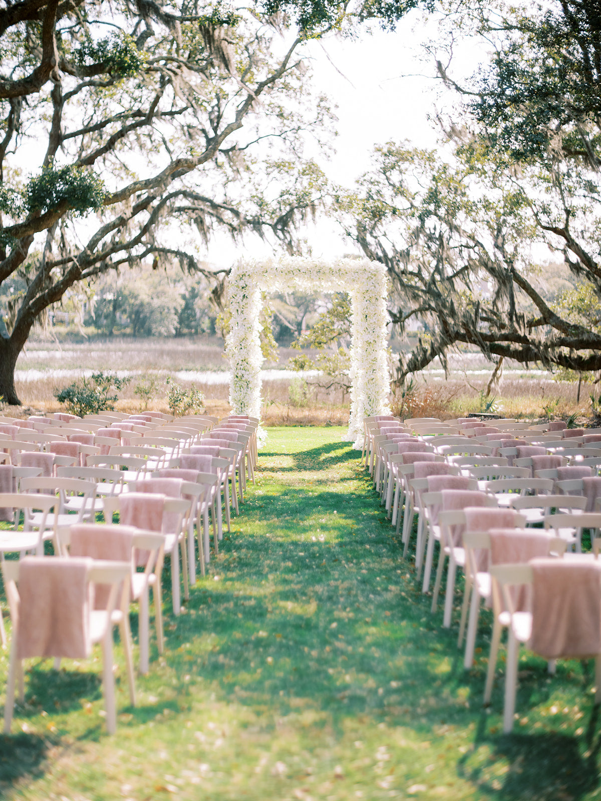 Ceremony at Dunlin under calla lily chuppah by Fox Events