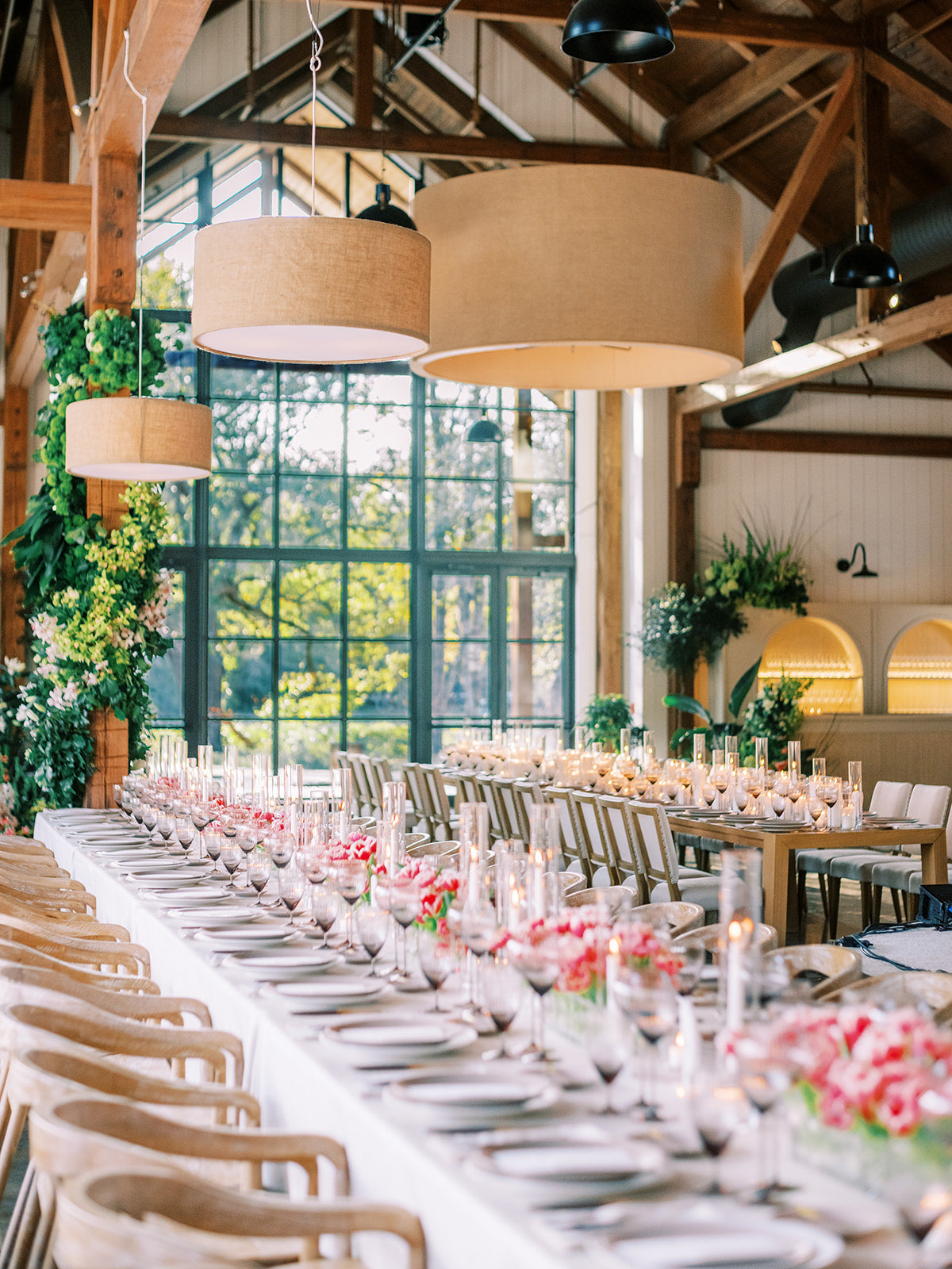 Reception table with sculptural florals and natural textures at Dunlin