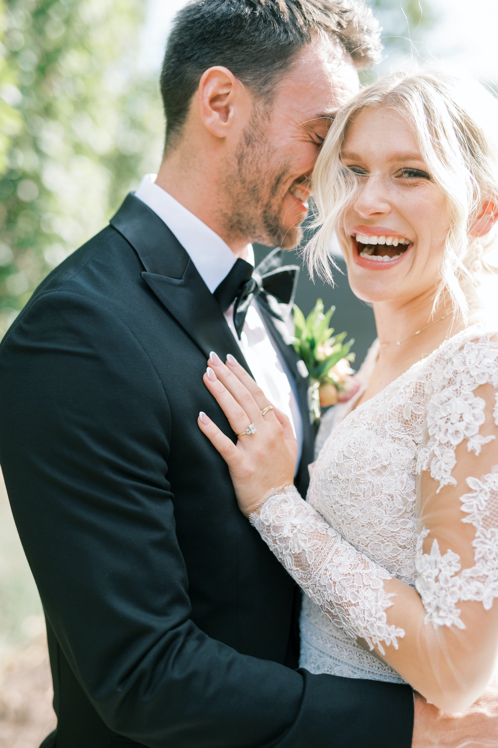 Portrait of a smiling bride and groom by wedding photographer Kéra Golombisky