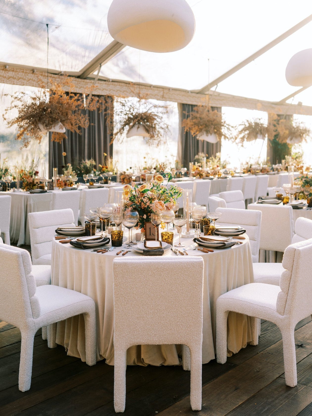Charleston wedding reception design with elegant draping, candlelight, and cohesive rental styling.