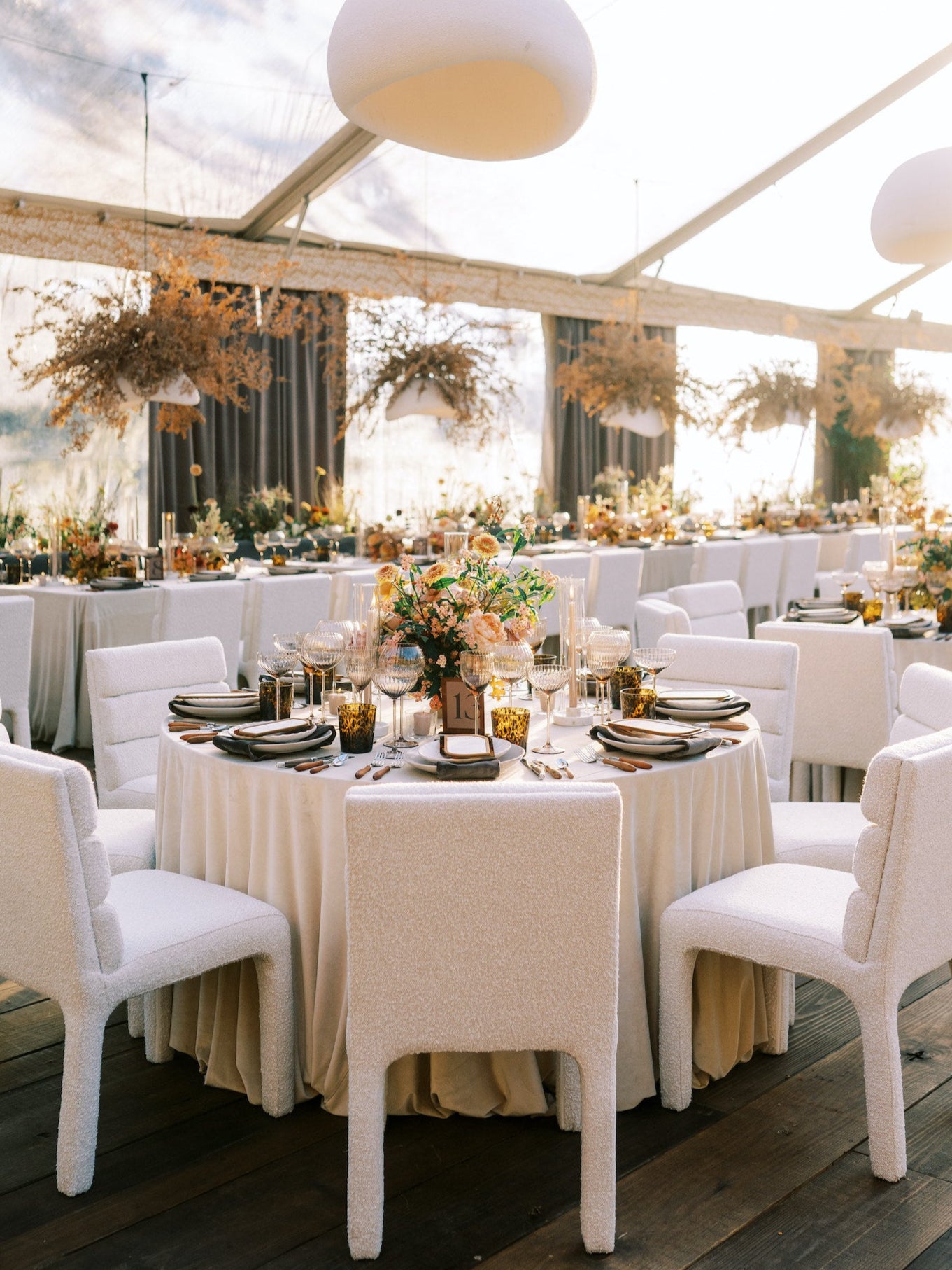 Charleston wedding reception design with elegant draping, candlelight, and cohesive rental styling.