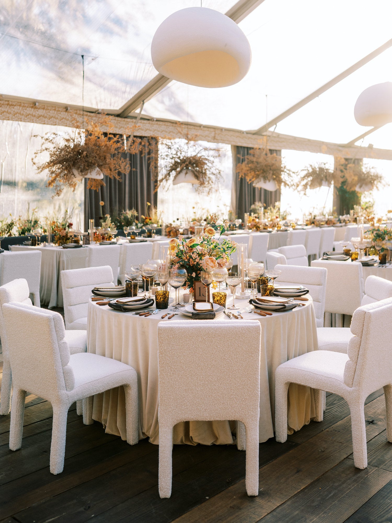 Charleston wedding reception design with elegant draping, candlelight, and cohesive rental styling.